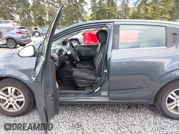 2013 Chevrolet Sonic LT with VIN 1G1JC6SG2D4148084, listed as a IAAI auction lot 43459236 with 94,963 mi miles and . Bid and sale history available at DreamBid. Image 5.