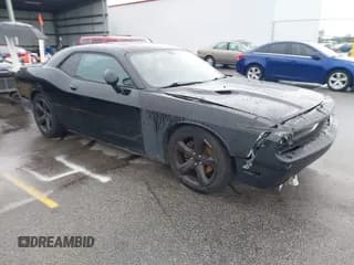 ✅ 2013 Dodge Challenger R/T • VIN: 2C3CDYBT5DH614393 • Lot: 42855411. Listed on IAAI with 156,283 mi. Free auction sales archive from the USA and detailed vehicle history report at DreamBid. Image 1.