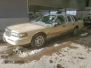 ✅ 1997 Lincoln Town Car Executive • VIN: 1LNLM81W1VY601022 • Lot: 82704885. Listed on Copart with 110,776 mi. Free auction sales archive from the USA and detailed vehicle history report at DreamBid. Image 1.