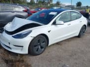✅ 2021 Tesla Model 3 Standard Range Plus • VIN: 5YJ3E1EA5MF086418 • Lot: 41252902. Wystawiony na IAAI z przebiegiem 7 858 mil. Bezpłatny archiwum sprzedaży aukcyjnych z USA i szczegółowy raport historii pojazdu na DreamBid. Zdjęcie 2.