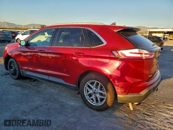✅ 2021 Ford Edge SEL • VIN: 2FMPK4J97MBA34577 • Lot: 96118085. Listed on Copart with 59,449 mi. Free auction sales archive from the USA and detailed vehicle history report at DreamBid. Image 2.