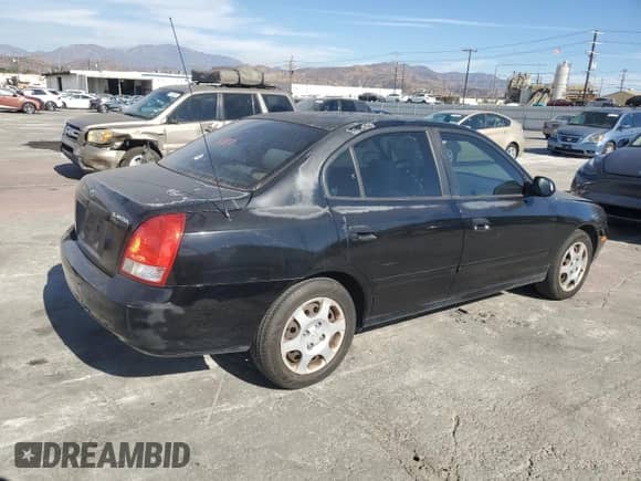 2003 Hyundai Elantra GLS with VIN KMHDN45D63U675382, listed as a Copart auction lot 76012974 with 140,218 mi miles and Salvage title. Bid and sale history available at DreamBid. Image 3.