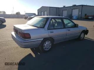 ✅ 1995 Ford Escort LX • VIN: 3FASP13J0SR159107 • Лот: 76715394. Опубликован ранее на Copart с пробегом 353 430 миль. Бесплатный доступ к архиву аукционных продаж из США и подробный отчёт об истории автомобиля на DreamBid. Изображение 3.