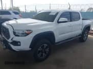 ✅ 2021 Toyota Tacoma SR • VIN: 3TMCZ5AN0MM387565 • Lot: 42300520. Listed on IAAI with 42,153 mi. Free auction sales archive from the USA and detailed vehicle history report at DreamBid. Image 2.