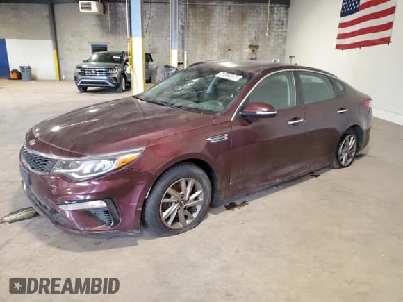 ✅ 2019 Kia Optima LX • VIN: 5XXGT4L30KG334064 • Лот: 91382375. Опубликован ранее на Copart с пробегом 74 162 миль. Бесплатный доступ к архиву аукционных продаж из США и подробный отчёт об истории автомобиля на DreamBid. Изображение 1.