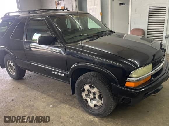 2003 Chevrolet Blazer LS z VIN 1GNCT18X83K175026, wystawiony jako Copart lot #60873315 z przebiegiem 200 267 mil mil oraz Czysty tytuł • Clean title. Historia ofert i sprzedaży dostępna na DreamBid. Obrazek 1.