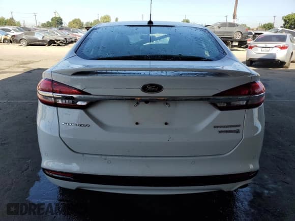 ✅ 2017 Ford Fusion Hybrid Titanium • VIN: 3FA6P0RUXHR234093 • Lot: 57997865. Wystawiony na Copart z przebiegiem 124 862 mil. Bezpłatny archiwum sprzedaży aukcyjnych z USA i szczegółowy raport historii pojazdu na DreamBid. Zdjęcie 6.