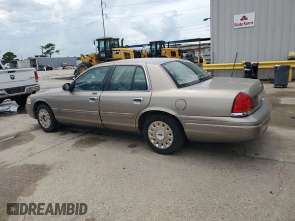 ✅ 2003 Ford Crown Victoria Standard • VIN: 2FAFP73W03X156758 • Lot: 61150295. Listed on Copart with 116,063 mi. Free auction sales archive from the USA and detailed vehicle history report at DreamBid. Image 2.