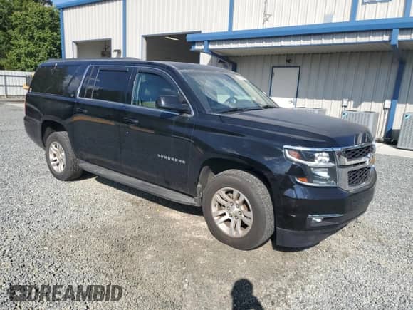 2015 Chevrolet Suburban LT with VIN 1GNSKJKC7FR698649, listed as a Copart auction lot 81584735 with 128,360 mi miles and Salvage title. Bid and sale history available at DreamBid. Image 4.