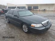 ✅ 2003 Lincoln Town Car Cartier • VIN: 1LNHM83W73Y651035 • Lot: 43579973. Listed on IAAI with 244,866 mi. Free auction sales archive from the USA and detailed vehicle history report at DreamBid. Image 1.