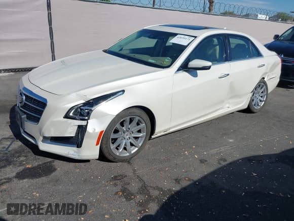 ✅ 2014 Cadillac CTS Performance RWD • VIN: 1G6AS5S31E0131693 • Lot: 42699171. Listed on IAAI with 104,565 mi. Free auction sales archive from the USA and detailed vehicle history report at DreamBid. Image 17.