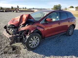 ✅ 2012 Mazda CX-7 i Touring • VIN: JM3ER2CM2C0421090 • Lot: 42378935. Wystawiony na Copart z przebiegiem 106 702 mil. Bezpłatny archiwum sprzedaży aukcyjnych z USA i szczegółowy raport historii pojazdu na DreamBid. Zdjęcie 1.