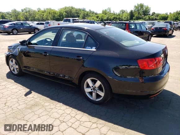 ✅ 2013 Volkswagen Jetta TDI w/Premium/Nav • VIN: 3VW3L7AJ7DM376098 • Lot: 65588905. Listed on Copart with 178,910 mi. Free auction sales archive from the USA and detailed vehicle history report at DreamBid. Image 2.