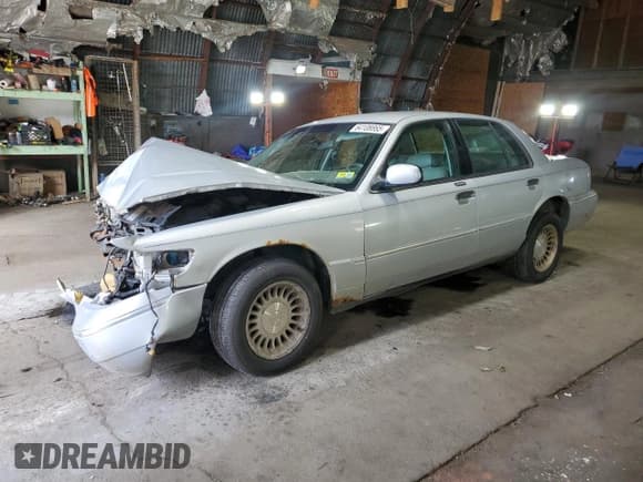 ✅ 2001 Mercury Grand Marquis LS • VIN: 2MEFM75W81X603977 • Лот: 64108865. Опубликован ранее на Copart с пробегом 187 153 миль. Бесплатный доступ к архиву аукционных продаж из США и подробный отчёт об истории автомобиля на DreamBid. Изображение 1.