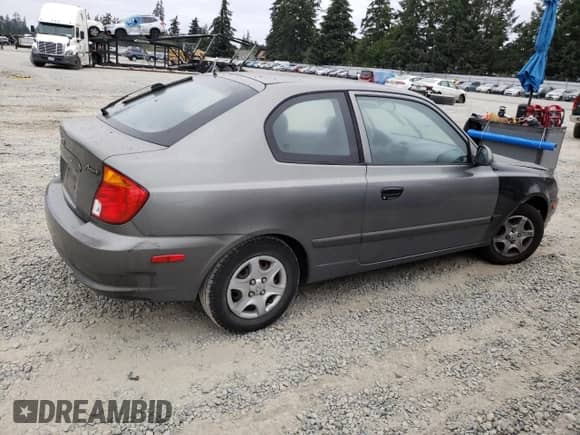 2004 Hyundai Accent GL with VIN KMHCG35C44U299645, listed as a Copart auction lot 63728174 with 159,604 mi miles and Clean title. Bid and sale history available at DreamBid. Image 3.