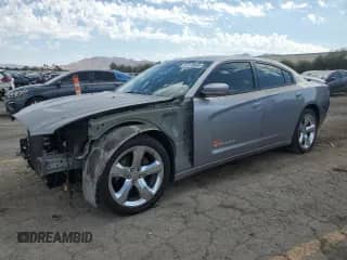 2014 Dodge Charger SXT with VIN 2C3CDXHG4EH305245, listed as a Copart auction lot 84276865 with 166,681 mi miles and Salvage title. Bid and sale history available at DreamBid. Image 1.