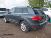 ✅ 2014 Volkswagen Touareg Sport • VIN: WVGEF9BP6ED007632 • Lot: 42183677. Listed on IAAI with 166,245 mi. Free auction sales archive from the USA and detailed vehicle history report at DreamBid. Image 3.