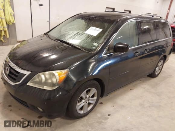✅ 2008 Honda Odyssey Touring • VIN: 5FNRL38958B017165 • Lot: 43575767. Listed on IAAI with 209,240 mi. Free auction sales archive from the USA and detailed vehicle history report at DreamBid. Image 2.