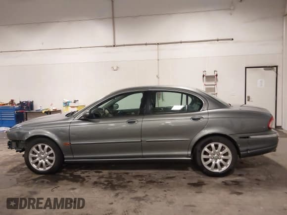 ✅ 2003 Jaguar X-Type 2.5L Manual • VIN: SAJEA51D33XD13416 • Lot: 43210908. Listed on IAAI with 195,057 mi. Free auction sales archive from the USA and detailed vehicle history report at DreamBid. Image 14.
