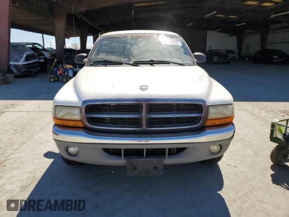 1999 Dodge Dakota SLT z VIN 1B7GL22Y5XS140838, wystawiony jako Copart lot #80016635 z przebiegiem 134 231 mil mil oraz Czysty tytuł • Clean title. Historia ofert i sprzedaży dostępna na DreamBid. Obrazek 5.