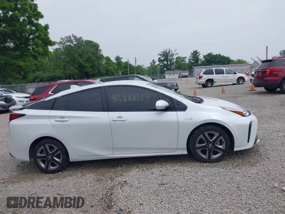 2021 Toyota Prius L Eco with VIN JTDKAMFU6M3137679, listed as a IAAI auction lot 42488129 with 52,414 mi miles and . Bid and sale history available at DreamBid. Image 14.