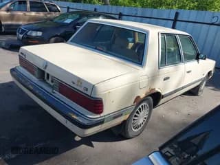 ✅ 1986 Plymouth Reliant • VIN: 1P3BP36D8GF153166 • Lot: 42307853. Listed on IAAI with Not provided. Free auction sales archive from the USA and detailed vehicle history report at DreamBid. Image 4.