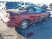 ✅ 2000 Pontiac Grand Am • VIN: 1G2NE12T5YM799819 • Lot: 43827279. Listed on IAAI with 167,017 mi. Free auction sales archive from the USA and detailed vehicle history report at DreamBid. Image 4.