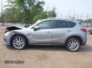 ✅ 2015 Mazda CX-5 Grand Touring • VIN: JM3KE4DY1F0530950 • Лот: 42425362. Опубликован ранее на IAAI с пробегом 120 088 миль. Бесплатный доступ к архиву аукционных продаж из США и подробный отчёт об истории автомобиля на DreamBid. Изображение 14.