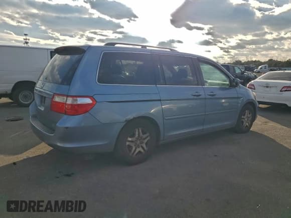 ✅ 2006 Honda Odyssey EX-L • VIN: 5FNRL38776B070297 • Лот: 95570655. Опубликован ранее на Copart с пробегом 124 763 миль. Бесплатный доступ к архиву аукционных продаж из США и подробный отчёт об истории автомобиля на DreamBid. Изображение 3.