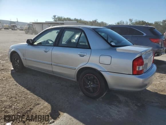 ✅ 2001 Mazda Protege DX • VIN: JM1BJ222210417508 • Lot: 83482064. Listed on Copart with Not provided. Free auction sales archive from the USA and detailed vehicle history report at DreamBid. Image 2.