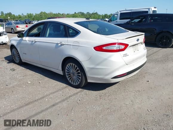 ✅ 2014 Ford Fusion Titanium Hybrid • VIN: 3FA6P0RU3ER279212 • Lot: 42241465. Listed on IAAI with 155,841 mi. Free auction sales archive from the USA and detailed vehicle history report at DreamBid. Image 3.