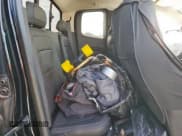 ✅ 2015 GMC Canyon 2WD SLE • VIN: 1GTH5BE3XF1243238 • Лот: 62090035. Опубликован ранее на Copart с пробегом 79 477 миль. Бесплатный доступ к архиву аукционных продаж из США и подробный отчёт об истории автомобиля на DreamBid. Изображение 10.