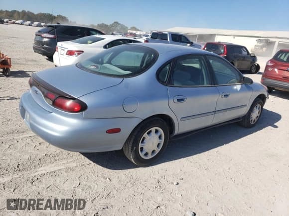 ✅ 1998 Ford Taurus LX • VIN: 1FAFP52U5WA273382 • Лот: 77102854. Опубликован ранее на Copart с пробегом 73 014 миль. Бесплатный доступ к архиву аукционных продаж из США и подробный отчёт об истории автомобиля на DreamBid. Изображение 3.