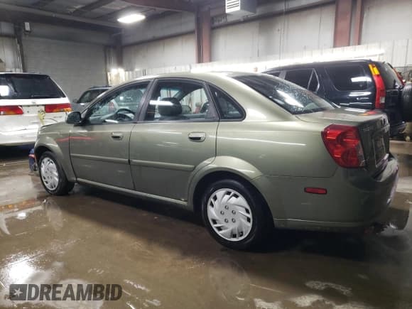 ✅ 2004 Suzuki Forenza S • VIN: KL5JD52Z14K975804 • Lot: 43227455. Listed on Copart with 114,726 mi. Free auction sales archive from the USA and detailed vehicle history report at DreamBid. Image 2.