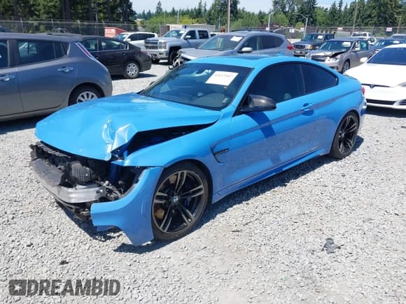 ✅ 2016 BMW M4 • VIN: WBS3R9C56GK336919 • Lot: 42623587. Listed on IAAI with 57,302 mi. Free auction sales archive from the USA and detailed vehicle history report at DreamBid. Image 2.