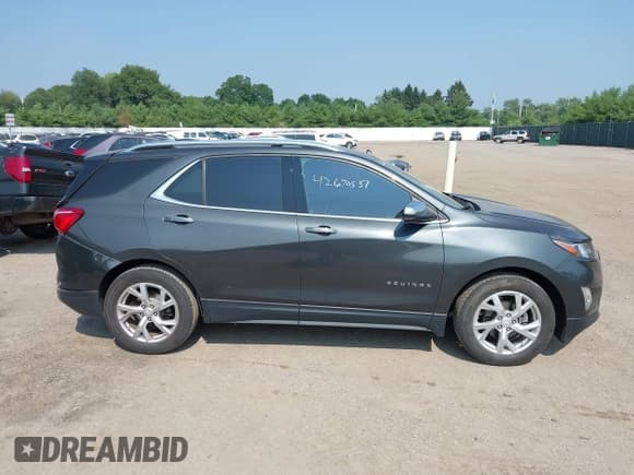 ✅ 2019 Chevrolet Equinox Premier • VIN: 2GNAXNEV4K6184569 • Lot: 42670537. Listed on IAAI with 163,594 mi. Free auction sales archive from the USA and detailed vehicle history report at DreamBid. Image 13.