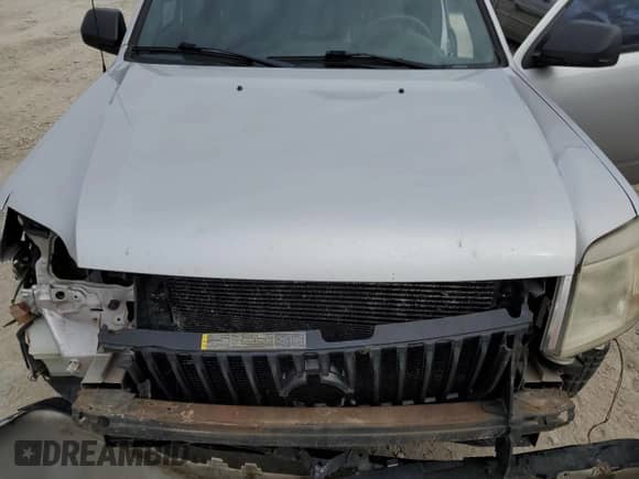 2011 Mercury Mariner z VIN 4M2CN8B73BKJ06886, wystawiony jako Copart lot #50308485 z przebiegiem 118 584 mil mil oraz Szkoda całkowita • Salvage title. Historia ofert i sprzedaży dostępna na DreamBid. Obrazek 13.