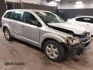 ✅ 2013 Dodge Journey SE • VIN: 3C4PDCAB7DT646083 • Lot: 42353530. Listed on IAAI with 117,965 mi. Free auction sales archive from the USA and detailed vehicle history report at DreamBid. Image 1.