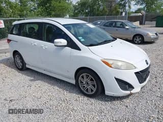 ✅ 2013 Mazda 5 Touring • VIN: JM1CW2CL5D0152097 • Lot: 42611731. Listed on IAAI with 230,179 mi. Free auction sales archive from the USA and detailed vehicle history report at DreamBid. Image 1.