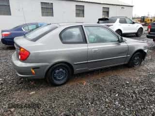 2003 Hyundai Accent GL z VIN KMHCG35C33U261046, wystawiony jako Copart lot #48846125 z przebiegiem 108 742 mil mil oraz Szkoda całkowita • Salvage title. Historia ofert i sprzedaży dostępna na DreamBid. Obrazek 3.