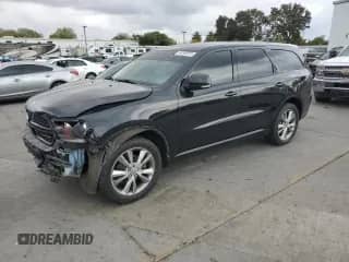2012 Dodge Durango R/T with VIN 1C4SDJCTXCC337979, listed as a Copart auction lot 84260975 with 202,080 mi miles and Salvage title. Bid and sale history available at DreamBid. Image 1.