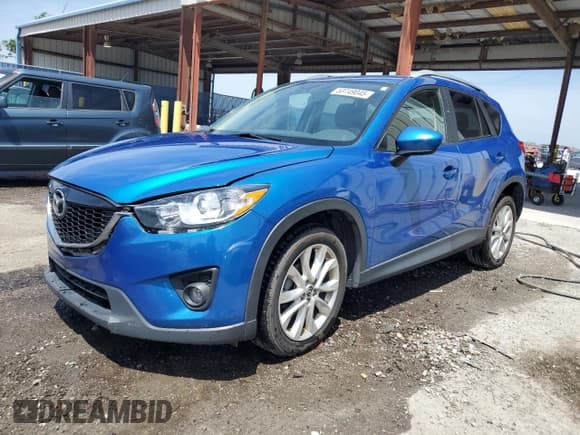 ✅ 2013 Mazda CX-5 Grand Touring • VIN: JM3KE2DE1D0152779 • Lot: 53749045. Listed on Copart with 100,419 mi. Free auction sales archive from the USA and detailed vehicle history report at DreamBid. Image 1.