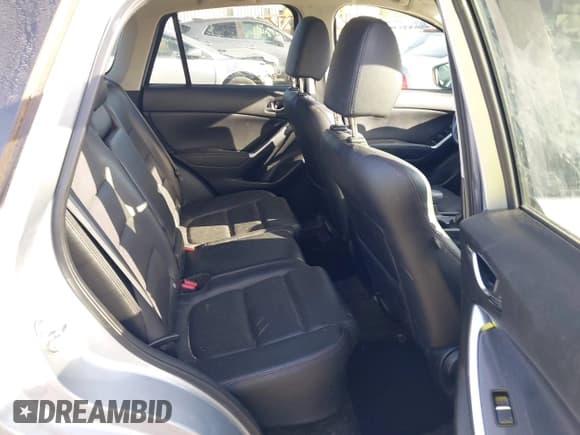 ✅ 2016 Mazda CX-5 Grand Touring • VIN: JM3KE2DY8G0604998 • Lot: 43696169. Listed on IAAI with 104,349 mi. Free auction sales archive from the USA and detailed vehicle history report at DreamBid. Image 8.