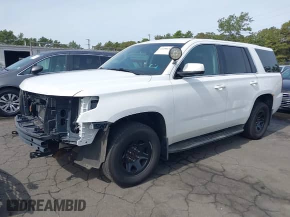 2016 Chevrolet Tahoe Commercial with VIN 1GNSKDEC7GR383557, listed as a IAAI auction lot 43286349 with 228,327 mi miles and . Bid and sale history available at DreamBid. Image 2.