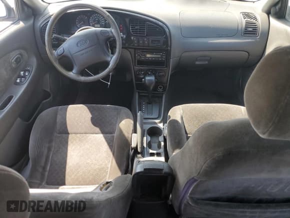 ✅ 2003 Kia Spectra GS • VIN: KNAFB161635094836 • Lot: 62873465. Listed on Copart with 117,872 mi. Free auction sales archive from the USA and detailed vehicle history report at DreamBid. Image 8.