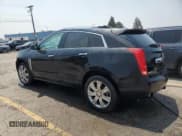 ✅ 2015 Cadillac SRX Premium Collection • VIN: 3GYFNGE3XFS573121 • Lot: 64599105. Wystawiony na Copart z przebiegiem 105 369 mil. Bezpłatny archiwum sprzedaży aukcyjnych z USA i szczegółowy raport historii pojazdu na DreamBid. Zdjęcie 2.
