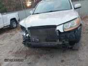 ✅ 2009 Hyundai Santa Fe SE • VIN: 5NMSH73E89H267854 • Lot: 43656984. Listed on IAAI with 174,340 mi. Free auction sales archive from the USA and detailed vehicle history report at DreamBid. Image 6.