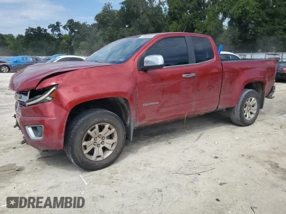 ✅ 2015 Chevrolet Colorado 4WD LT • VIN: 1GCHTBEA0F1127812 • Лот: 70855654. Опубликован ранее на Copart с пробегом 129 204 миль. Бесплатный доступ к архиву аукционных продаж из США и подробный отчёт об истории автомобиля на DreamBid. Изображение 1.