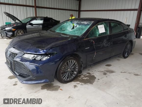 ✅ 2021 Toyota Avalon Hybrid XSE • VIN: 4T1EA1AB4MU002675 • Lot: 43434385. Listed on IAAI with 261,055 mi. Free auction sales archive from the USA and detailed vehicle history report at DreamBid. Image 2.