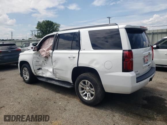 ✅ 2020 Chevrolet Tahoe LT • VIN: 1GNSCBKCXLR143208 • Lot: 67521985. Listed on Copart with 105,720 mi. Free auction sales archive from the USA and detailed vehicle history report at DreamBid. Image 2.